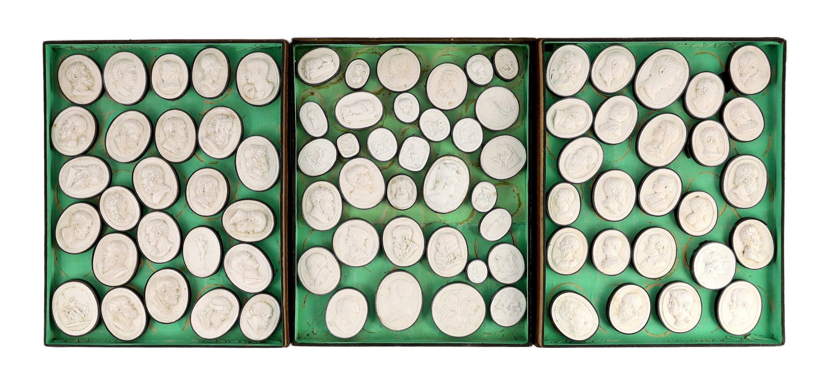 A cased set of eighty three Italian Grand Tour plaster roundels after intaglios of various subjects, box 29 x 22.5cm, largest cameo 5 x 4cm